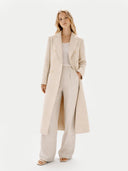 Women's  Double-Breasted Long Coat Beige worn by model front view on white background