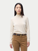 Women's Cashmere Mock Neck Sweater Off White worn by model, detail view, on white background