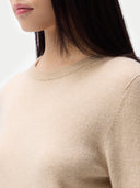 Cashmere Crewneck Sweater Beige worn by model, detail view, on white background