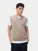 Men’s taupe cashmere vest worn by model, detail view, on white background