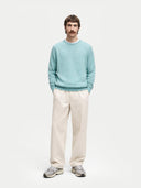 Men's Blue Haze Cashmere Crewneck Sweater worn by model, front view on white background 