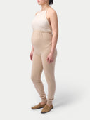 Over Bump Maternity Cashmere Knit Pants Beige worn by model, side view on white background