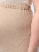 Over Bump Maternity Cashmere Knit Pants Beige worn by model, detail view on white background