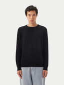 Men's Black Crewneck Cashmere Sweater worn by model, detail view on white background