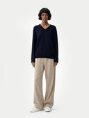 Women's Navy Cashmere V-Neck Sweater worn by model, front view on white background