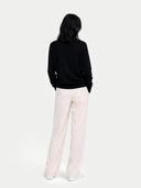 Women's Black Cashmere Crewneck Sweater worn by model, black view on white background
