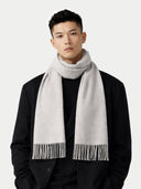 Cashmere Fringed Scarf Dawn Blue worn by model, detail view on white background