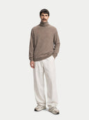 Men's Taupe Turtleneck Cashmere Sweater worn by model, front view on white background