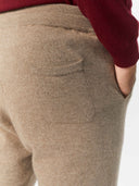 Men's Cashmere Jogger Taupe worn by model, detail view on white background