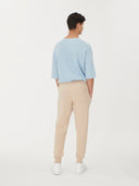 Men's Cashmere Jogger Beige worn by model, back view on white background