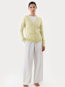 Women's  Tender Yellow Cashmere V-Neck Sweater worn by model, front view on white background  